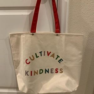 Clarins cultivate kindness bag with 4 trial size bottles.